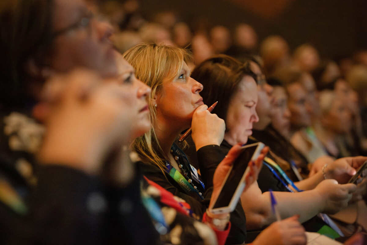 Member of the crowd listening to keynote speech